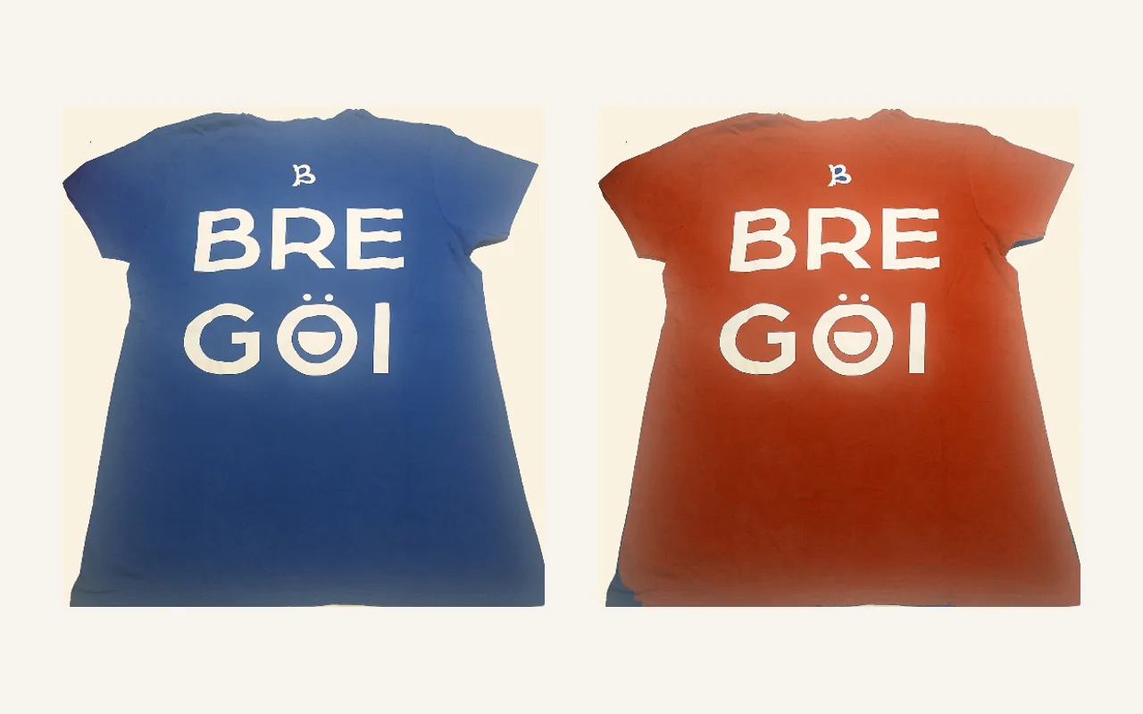 Before and after: a blue T-shirt recolored to rust red, with the white print left untouched.